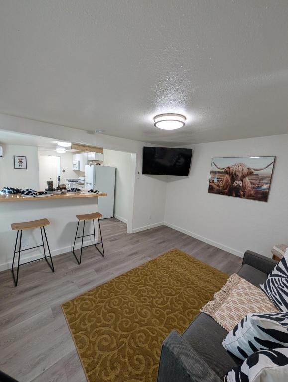 a living room with a couch and a kitchen at Casa Valencia in Tucson