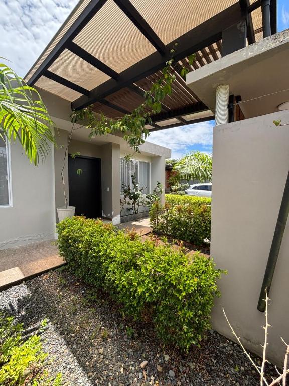 a view of a house with a pergola at Casa en Puyo Amazonía "Villa Coral" in Puyo