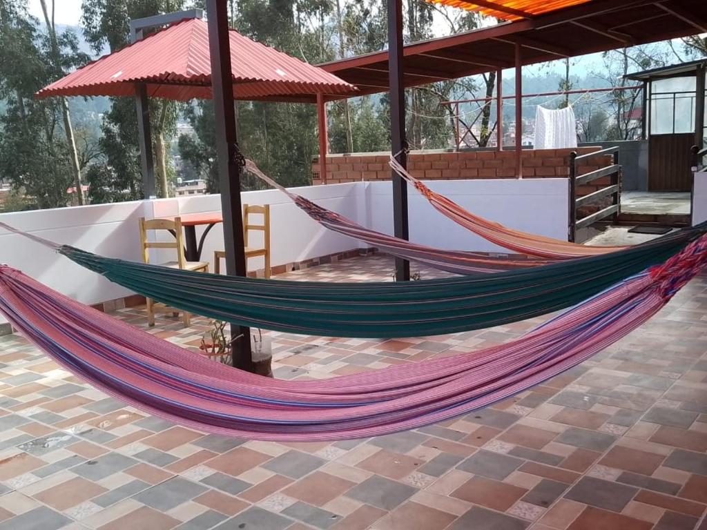 a couple of hammocks sitting on a patio at Amazing Huaraz in Huaraz