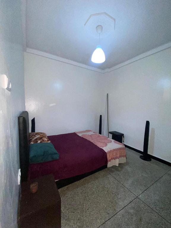 Ένα ή περισσότερα κρεβάτια σε δωμάτιο στο Atlas Agdal Apartment