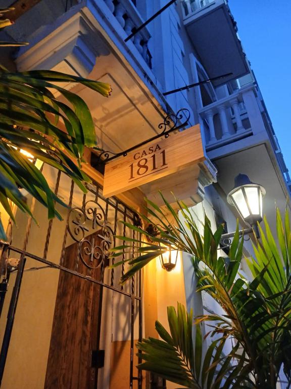 a street sign on the side of a building at Casa 1811 in Cartagena de Indias