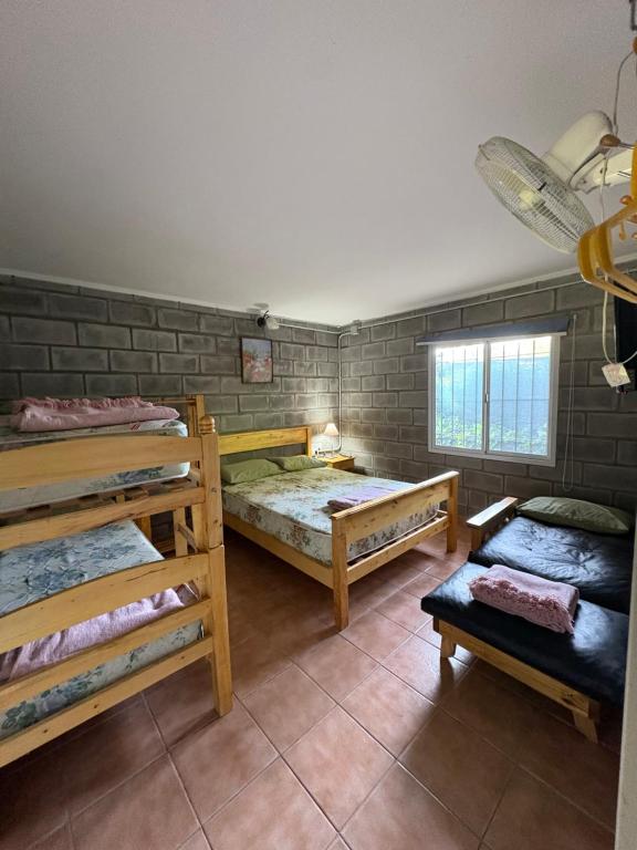 Ένα ή περισσότερα κρεβάτια σε δωμάτιο στο Aloja pehuen