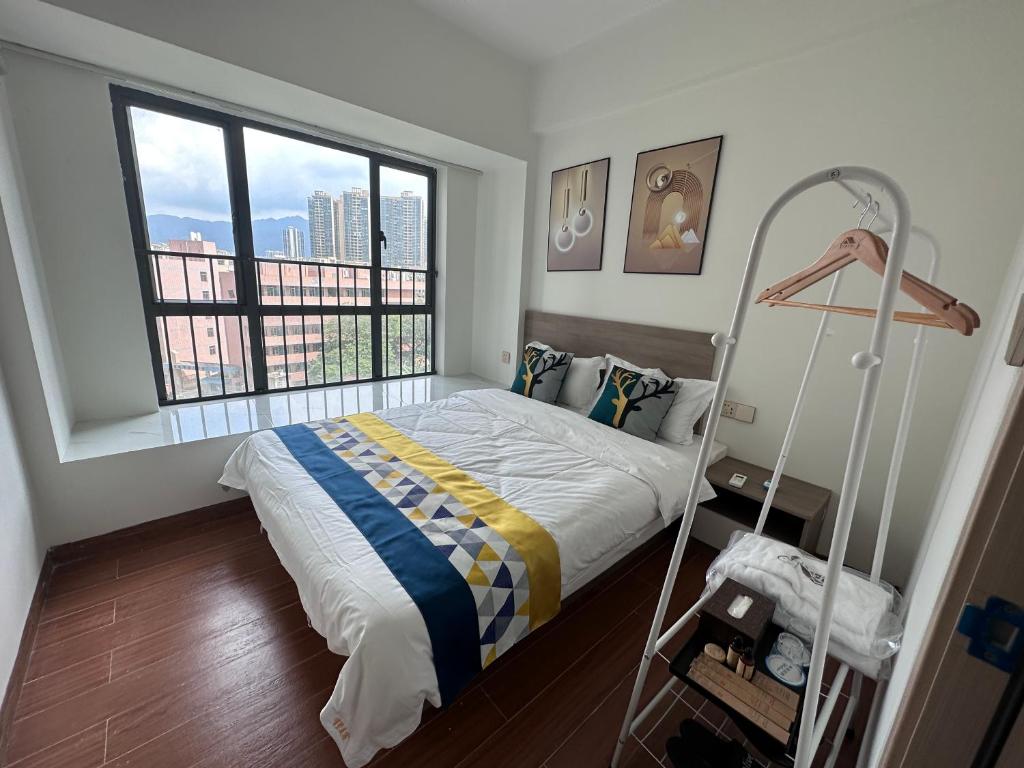 Ένα ή περισσότερα κρεβάτια σε δωμάτιο στο Yihuju 3-Bedroom, 2-Living Room Suite