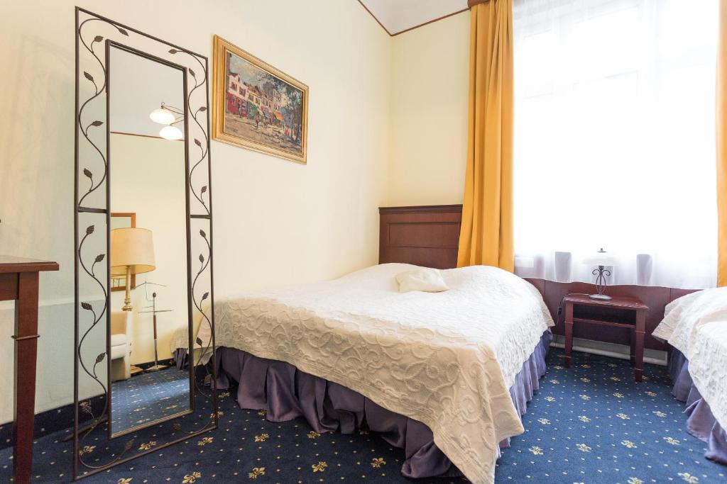 Voodi või voodid majutusasutuse Hotel Viktoria Schönbrunn toas