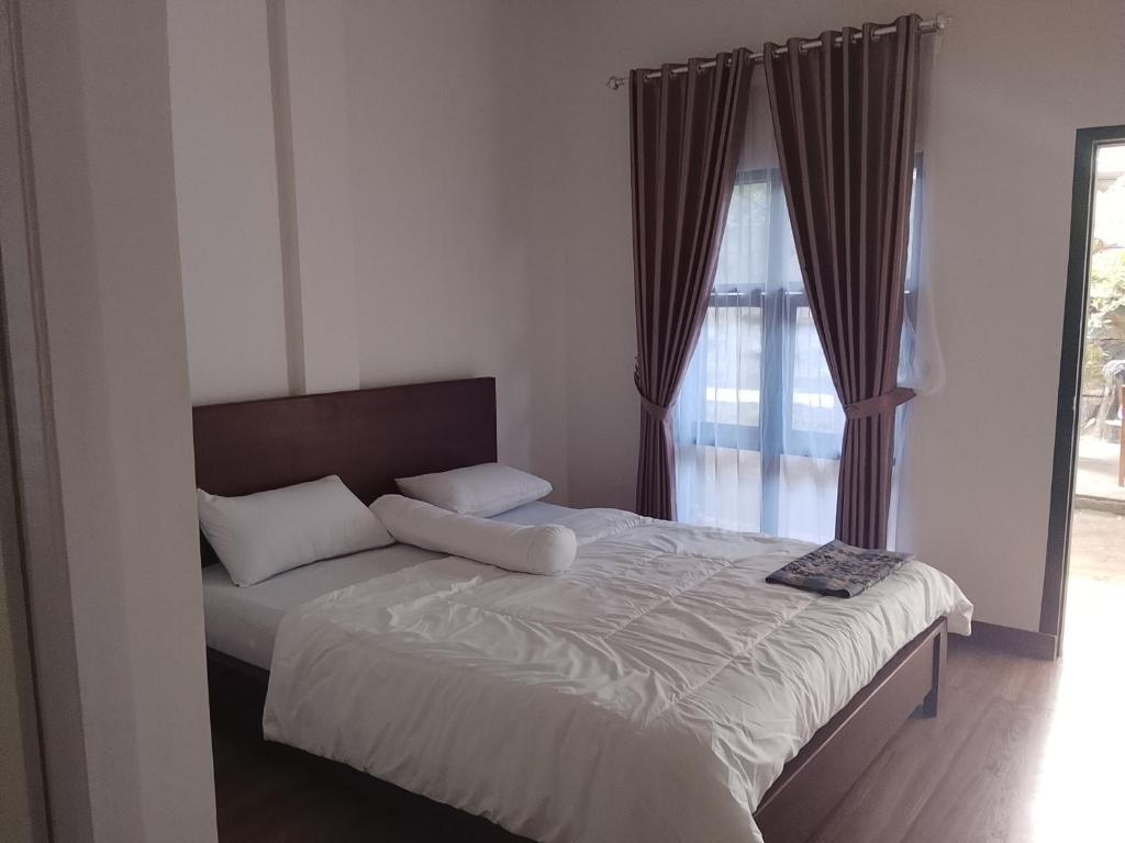 Postel nebo postele na pokoji v ubytování Pandava House Lombok
