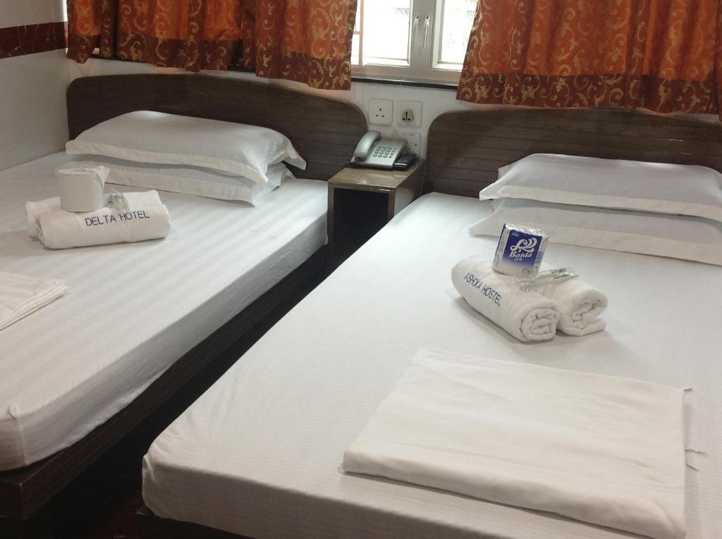 Postel nebo postele na pokoji v ubytování Woodstock Hostel