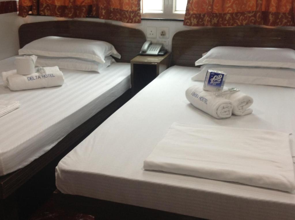 Postel nebo postele na pokoji v ubytování Woodstock Hostel
