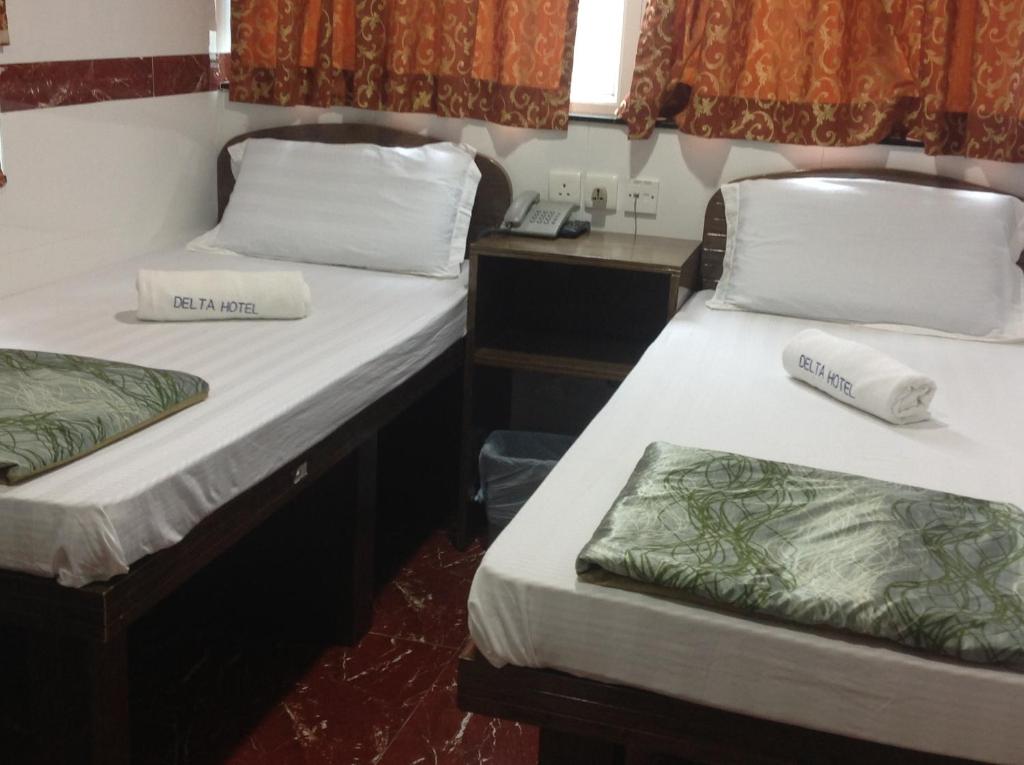 Postel nebo postele na pokoji v ubytování Woodstock Hostel