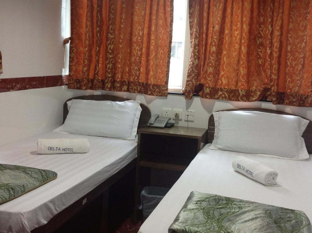 Postel nebo postele na pokoji v ubytování Woodstock Hostel