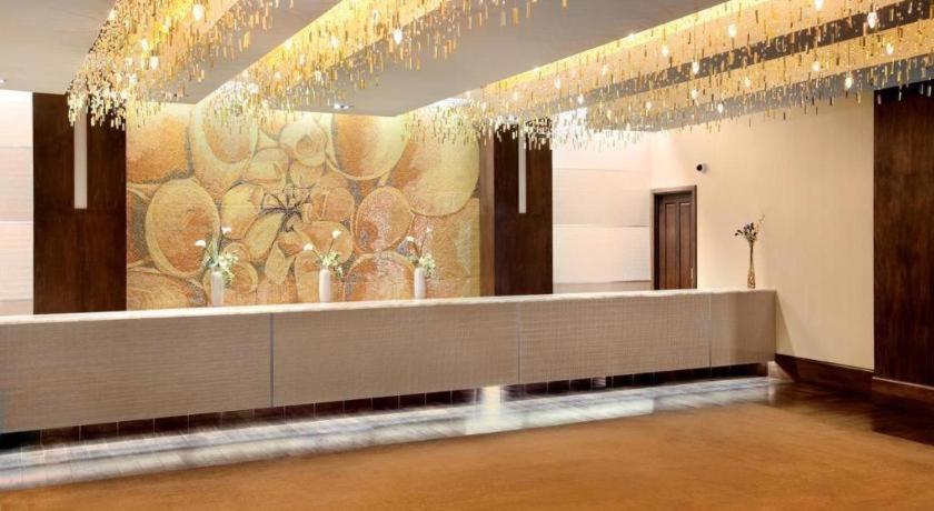 a lobby with a wall with a chandelier at Blue Chip Casino Hotel Spa in Michigan City
