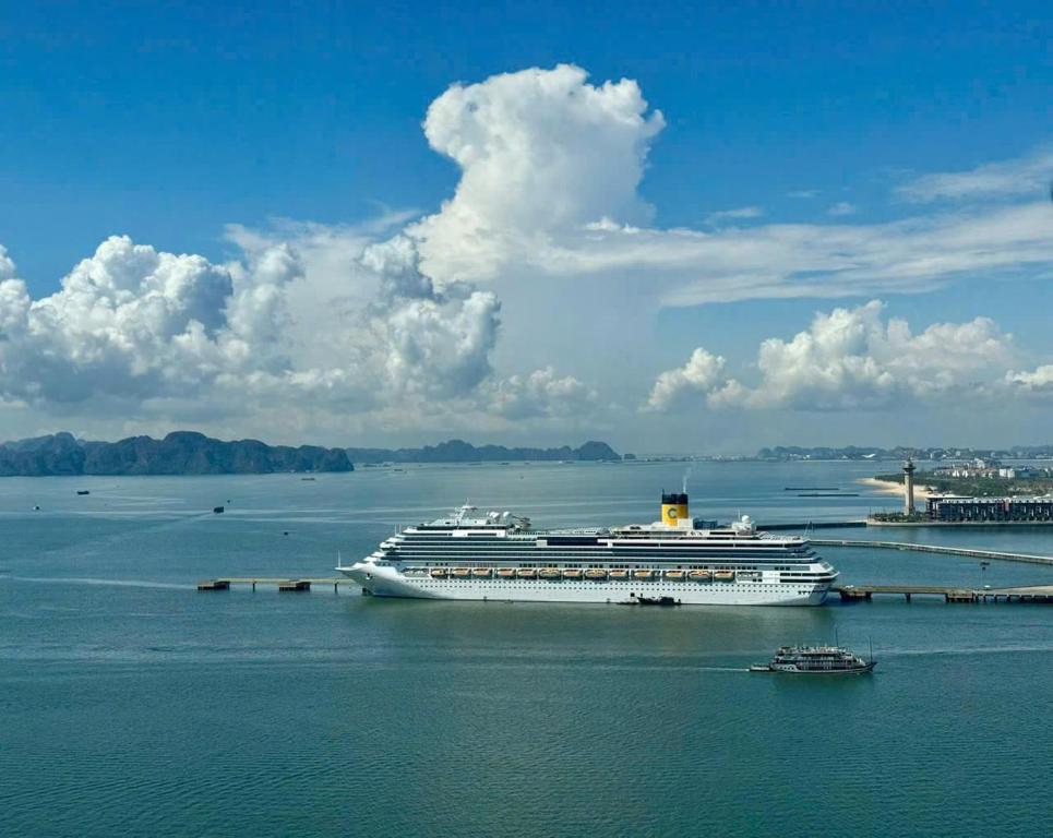 a cruise ship is docked in the water at Sapphire home S2 in Ha Long