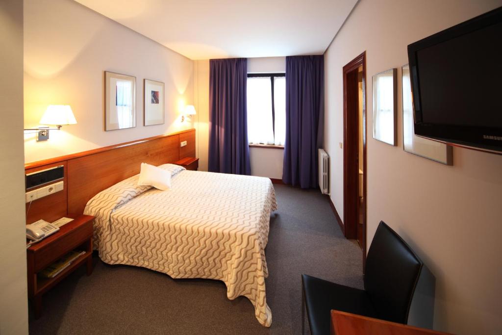 Postel nebo postele na pokoji v ubytování Hotel Anoeta