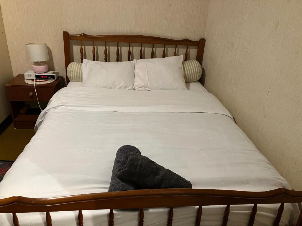 a bed with a stuffed animal sitting on top of it at Le Nazareth in Lyon