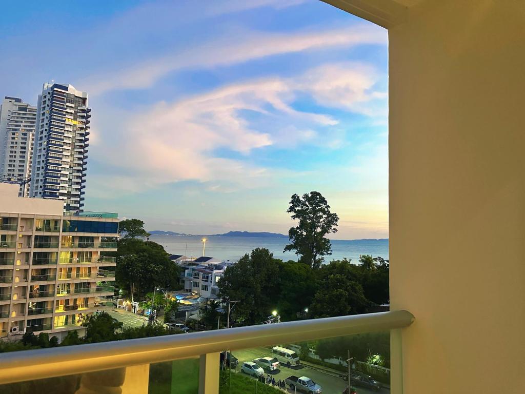 a view of the ocean from a balcony at Sands Condo Pattaya-Seaview by the Beach in Pattaya South
