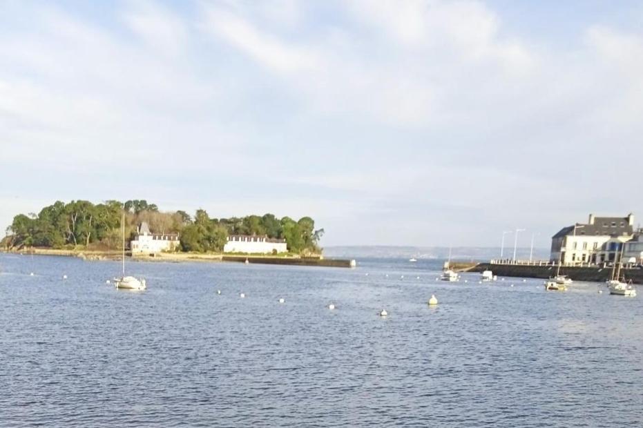 a large body of water with boats in it at Port Rhu Appartement 4 personnes in Douarnenez