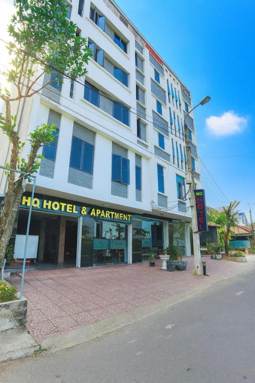 a hotel and apartment building on a city street at HQ Hotel & Apartment in Hai Phong