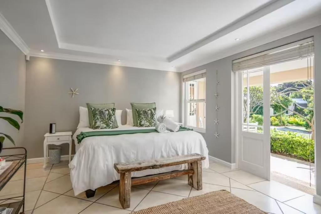 a bedroom with a large bed and a window at #5B on Brassie in Lakeside