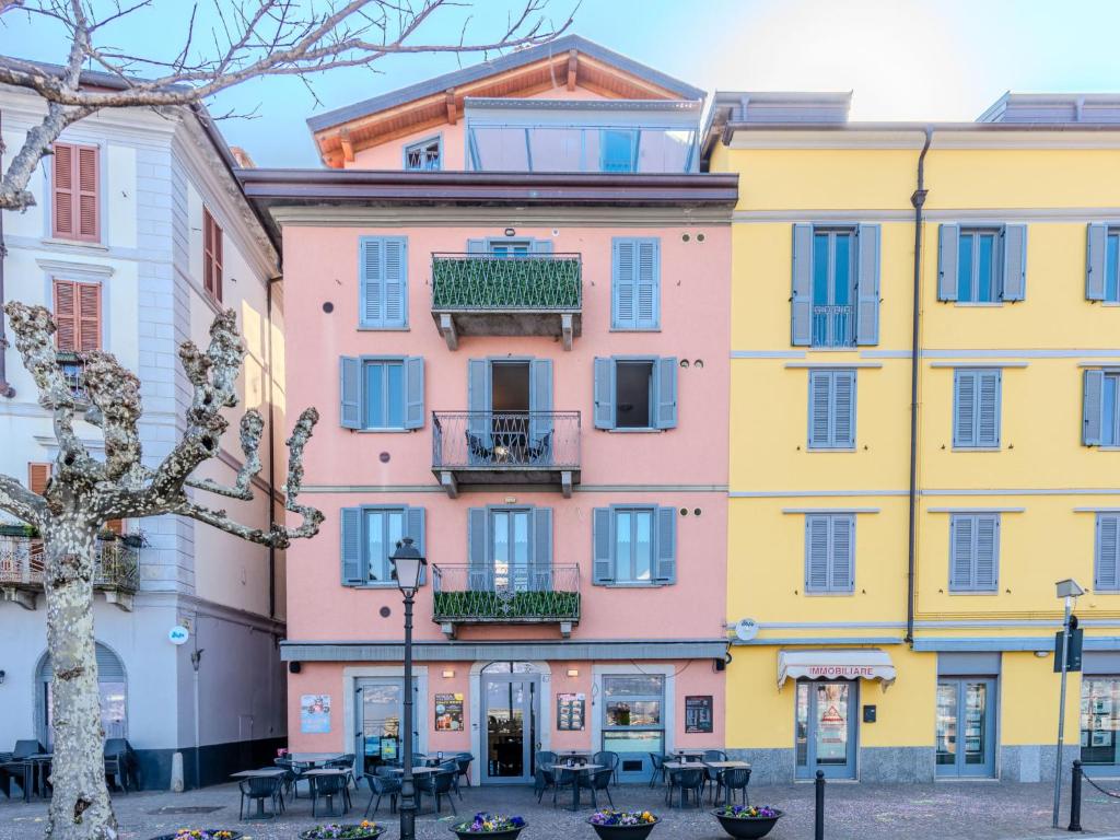 a row of colorful buildings in a city at Apartment Blue Lake by Interhome in Bellano