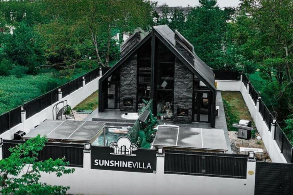 a house with a swimming pool in the middle at Sunshine Villa in Atakum