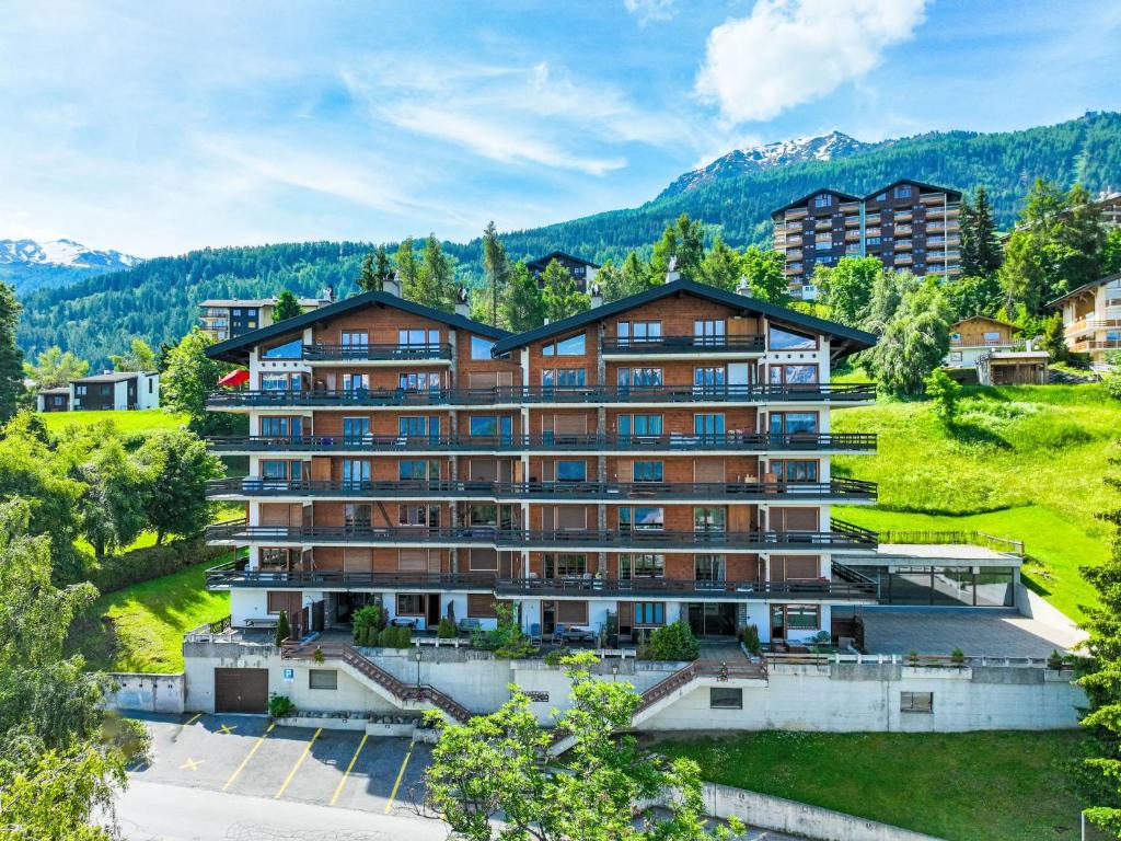 an aerial view of a hotel with mountains in the background at Apartment Bietschorn 33 by Interhome in Nendaz
