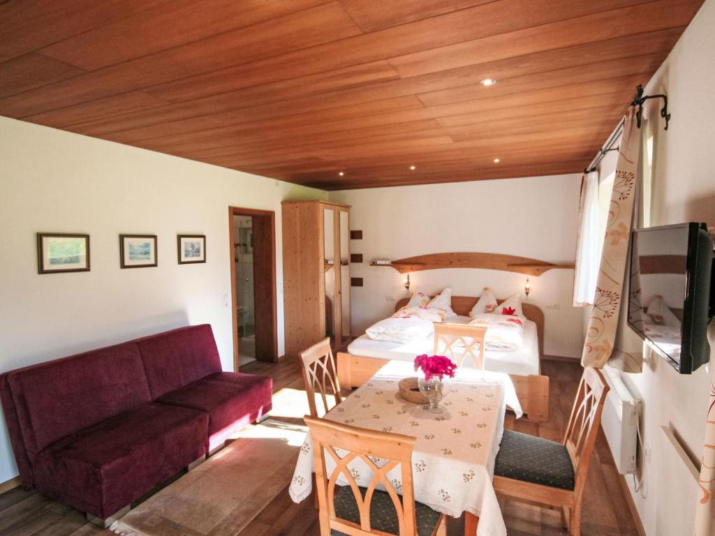 a room with a bed and a couch and a table at Apartment Studio Grenta by Interhome in Gortipohl