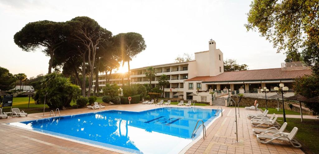 a large swimming pool in front of a hotel at AZZ Guadacorte Campo de Gibraltar in Los Barrios