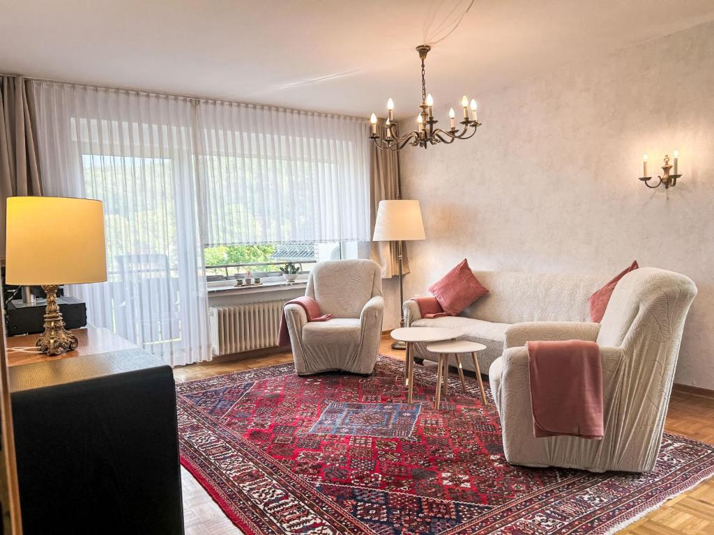 a living room with a couch and chairs and a rug at Apartment Celine by Interhome in Lügde