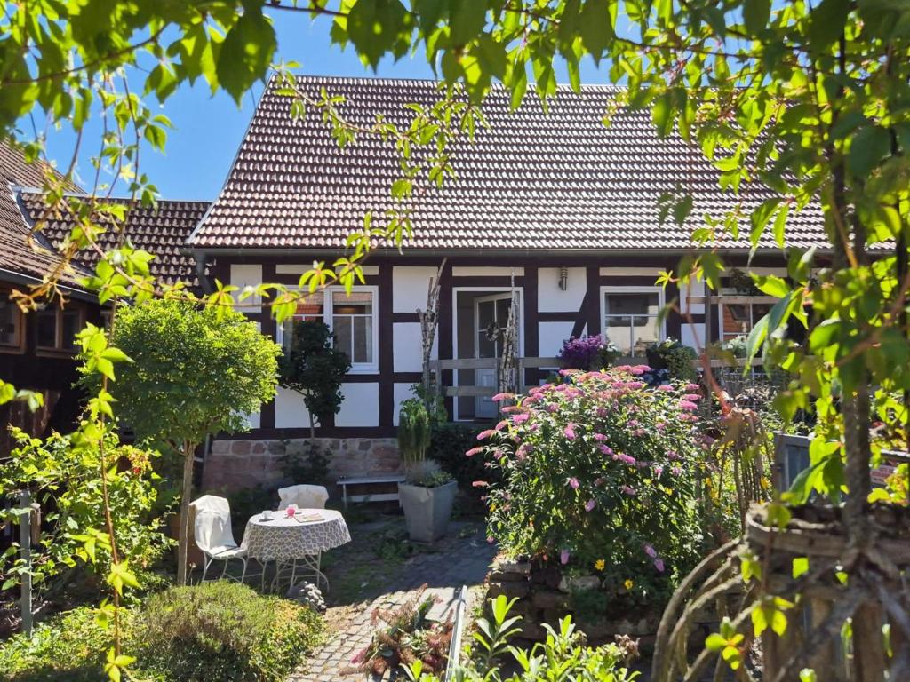 a house with a garden in front of it at Apartment Bärbel by Interhome in Suhl