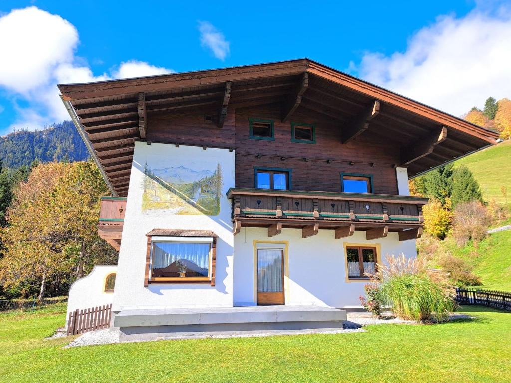 a house in the mountains with a wooden roof at Holiday Home Gernkogel by Interhome in Vorderkrimml