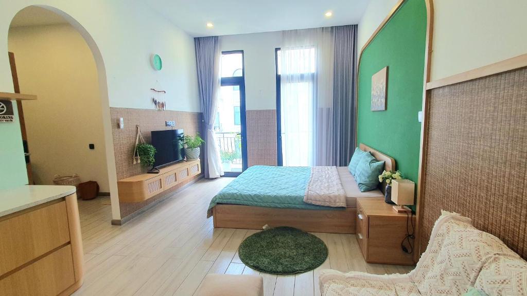 Ένα ή περισσότερα κρεβάτια σε δωμάτιο στο Andi Homestay-Vinhomes Grand Park