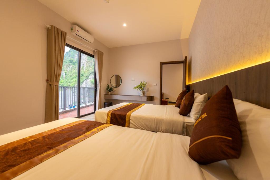 Ένα ή περισσότερα κρεβάτια σε δωμάτιο στο Cat Ba Viet Hoa ApartHotel