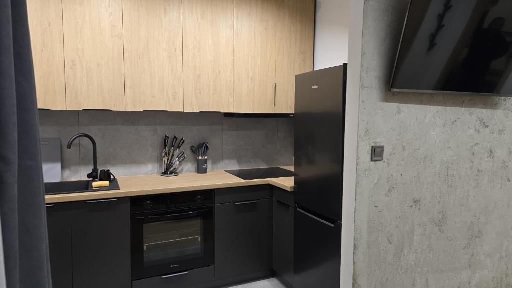 Η κουζίνα ή μικρή κουζίνα στο Apartamenty Żurawia 1 - Piętro 1