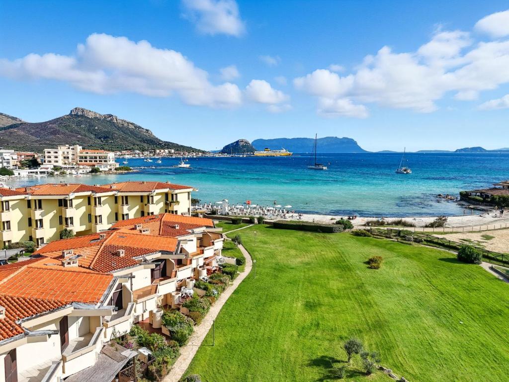 a view of the ocean from a resort at Apartment Iris 5- Terza Spiaggia by Interhome in Golfo Aranci