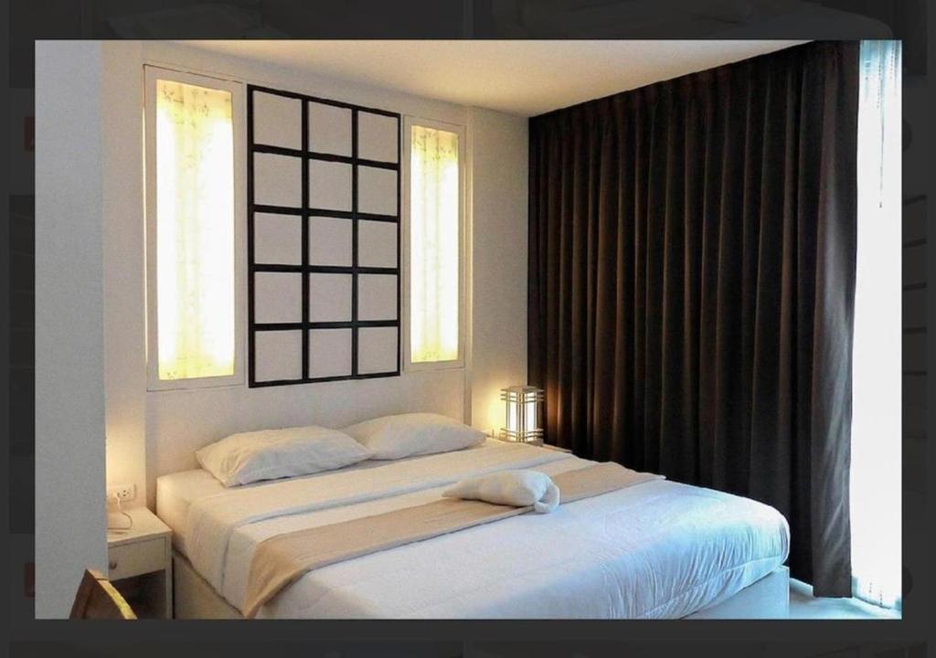 Postel nebo postele na pokoji v ubytování Nimman S Condo 60sqm with Pool Gym