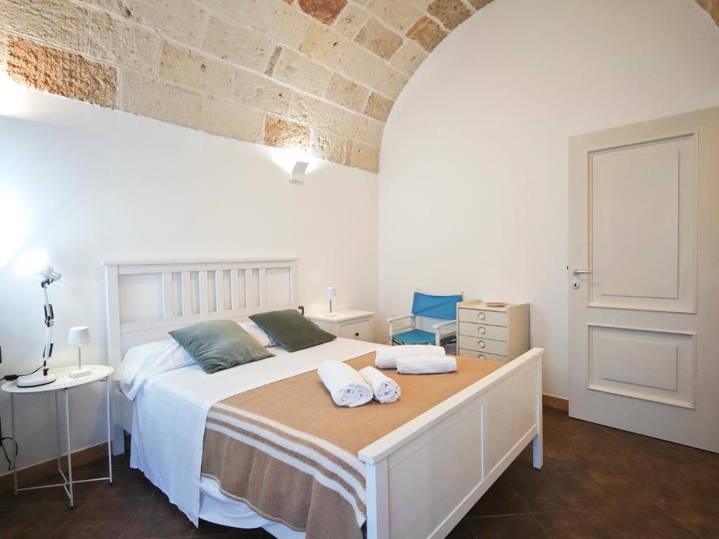 Postel nebo postele na pokoji v ubytování Torretta del Centro