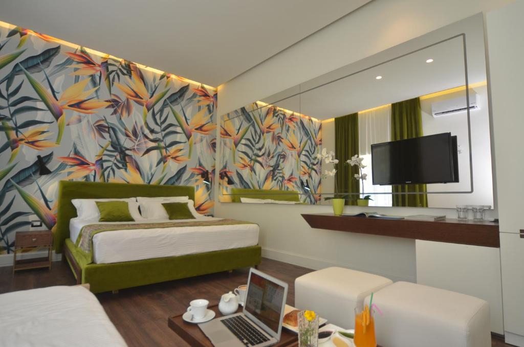TV a/nebo společenská místnost v ubytování Le Palazzine Hotel