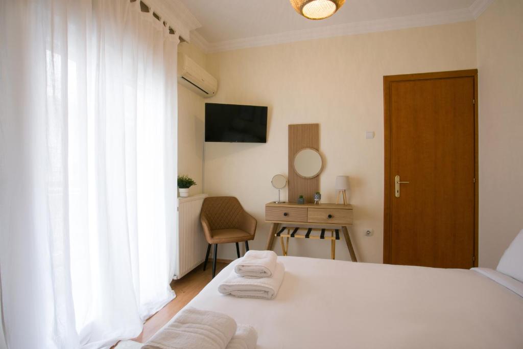 Ένα ή περισσότερα κρεβάτια σε δωμάτιο στο White Cozy Stay