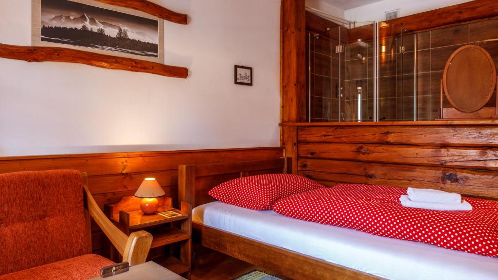 A bed or beds in a room at Penzion Barborka