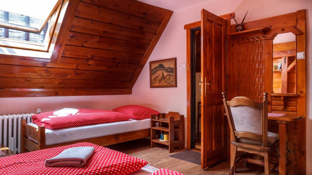 A bed or beds in a room at Penzion Barborka