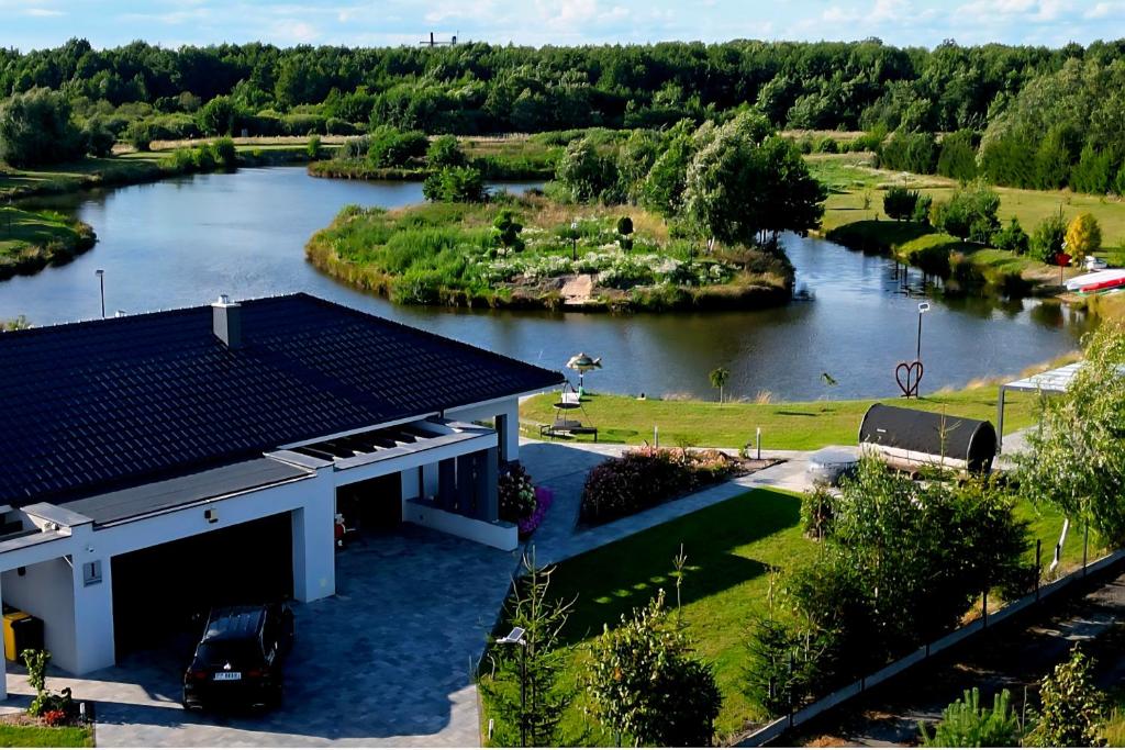 an aerial view of a river with a house at Willa Skrzatusz in Skrzatusz