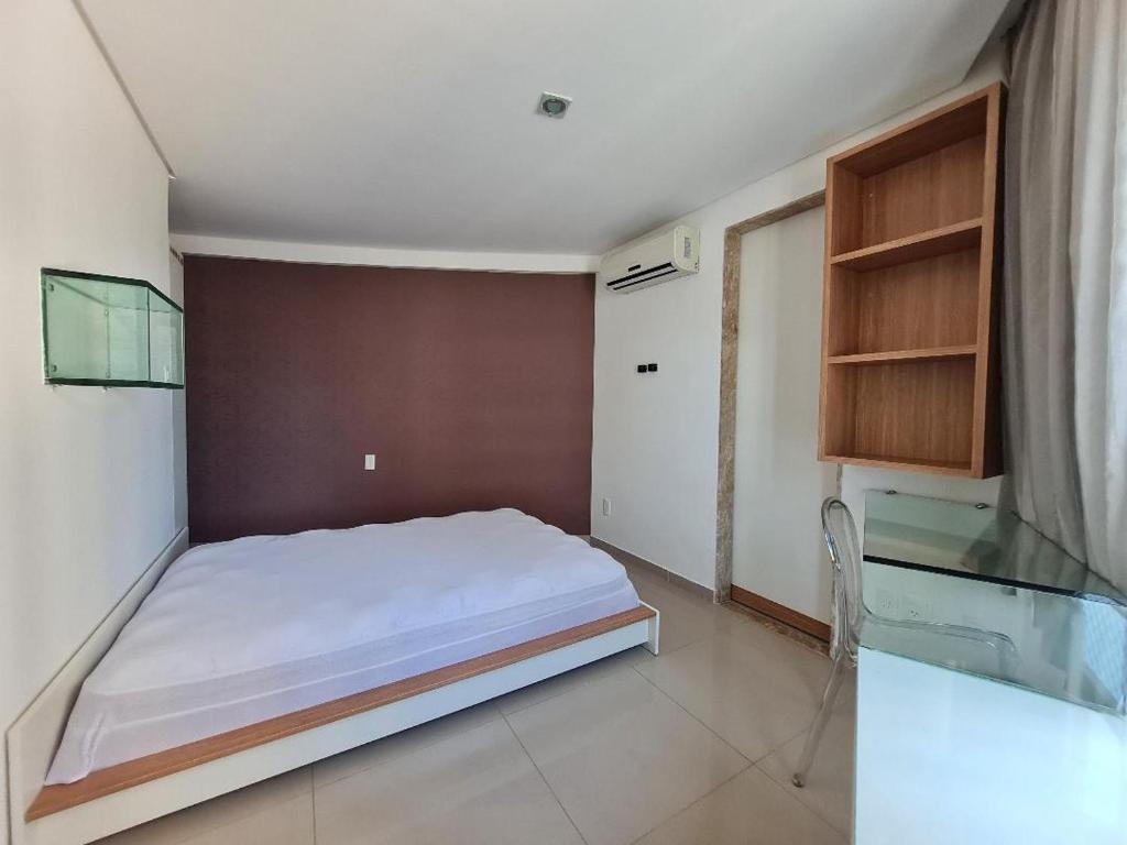 Ένα ή περισσότερα κρεβάτια σε δωμάτιο στο Flat mobiliado e bem localizado