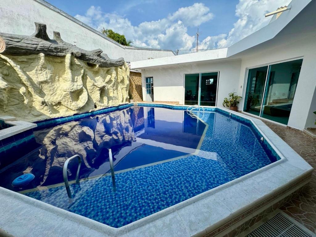 a swimming pool in the middle of a house at Casa palma Cartagena de Indias, Colombia in Cartagena de Indias
