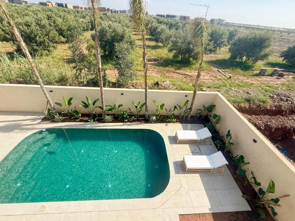 Πισίνα στο ή κοντά στο The Sultans House - Luxe Villa in Marrakech met Verwarmd Privezwembad