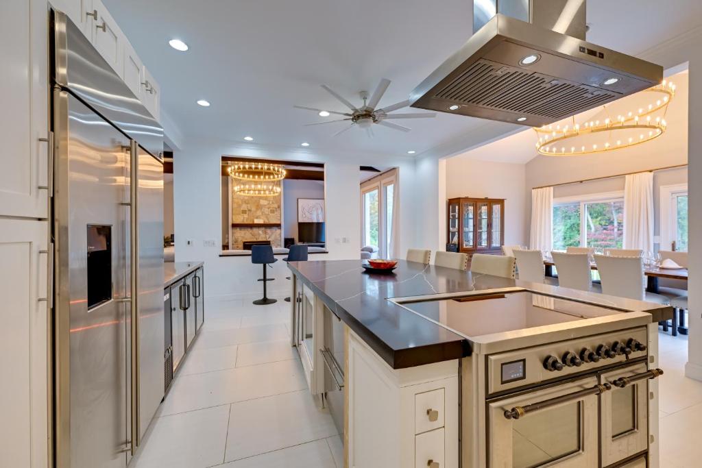 a kitchen with a large island with a counter top at High-End Estate in Norwalk Quiet and Spacious! in New Canaan