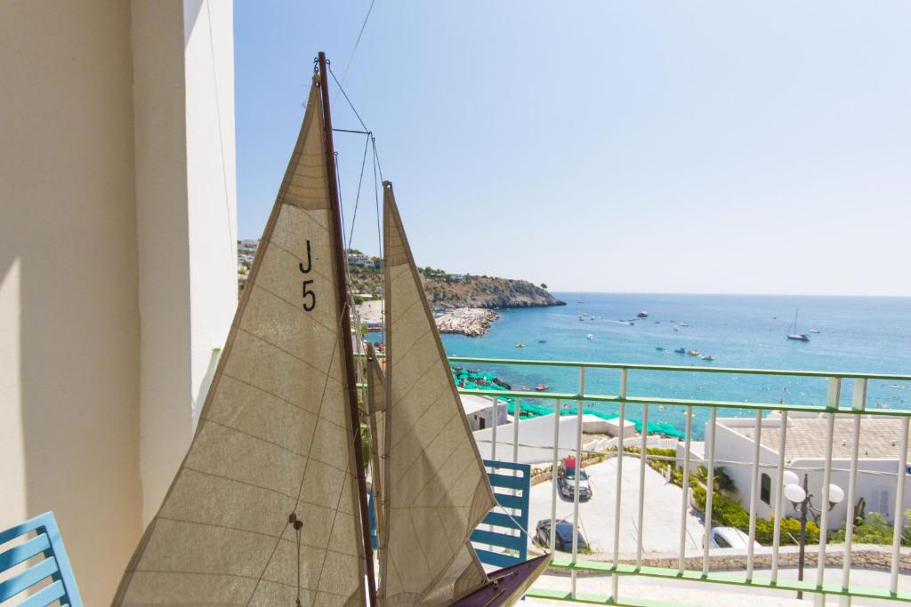 a sail boat on a balcony with a view of the ocean at Luna Rossa in Castro di Lecce