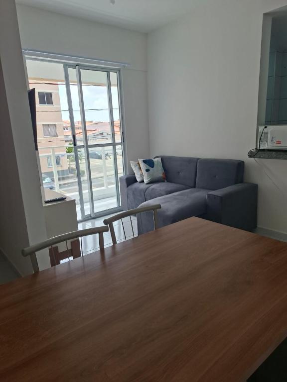 a living room with a couch and a table at my sweet place 19 in São Luís