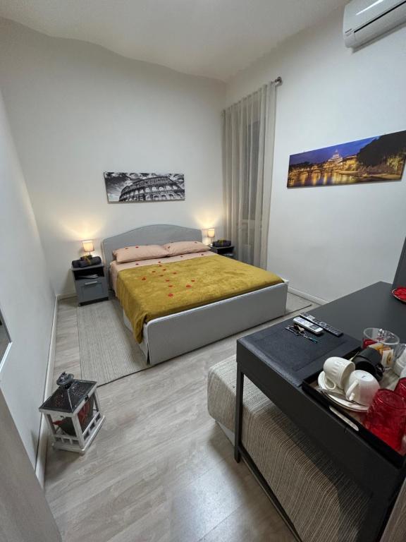 a large bedroom with a bed and a table at Vatican Stay Ottaviano in Rome