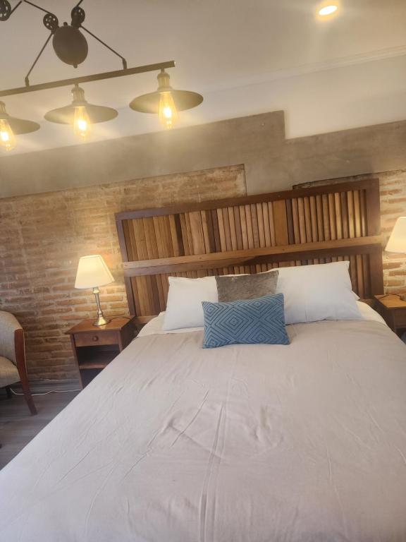 Una cama o camas en una habitación de Loft low cost Cachagua