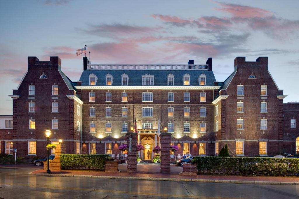 a large brick building with an entrance at night at Hotel Viking in Newport