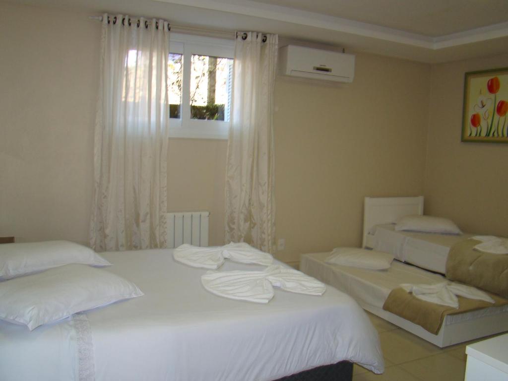 Cama o camas de una habitación en Apartamentos Pórtico II